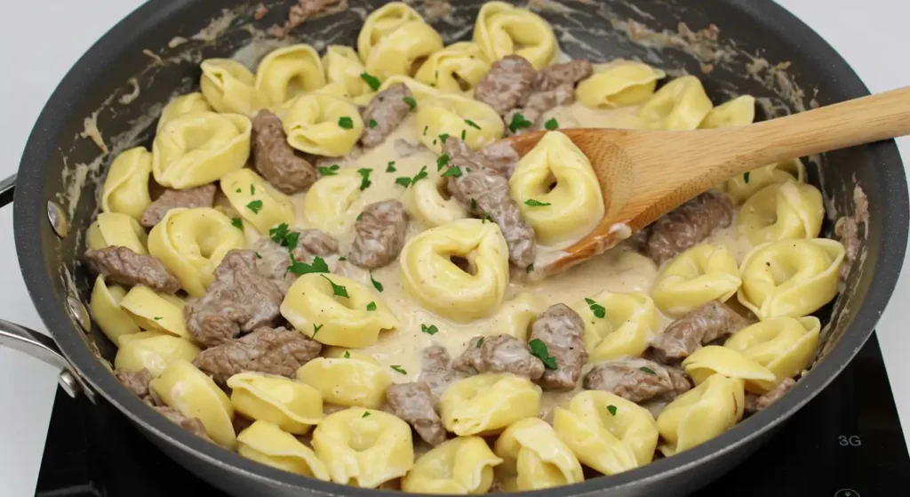 cheesesteak tortellini in rich provolone sauce