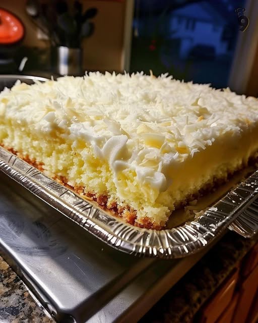 Soft white cake soaked in cream of coconut
